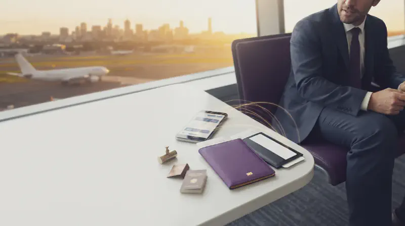 A smartphone beside a simple world map highlighting Australia.