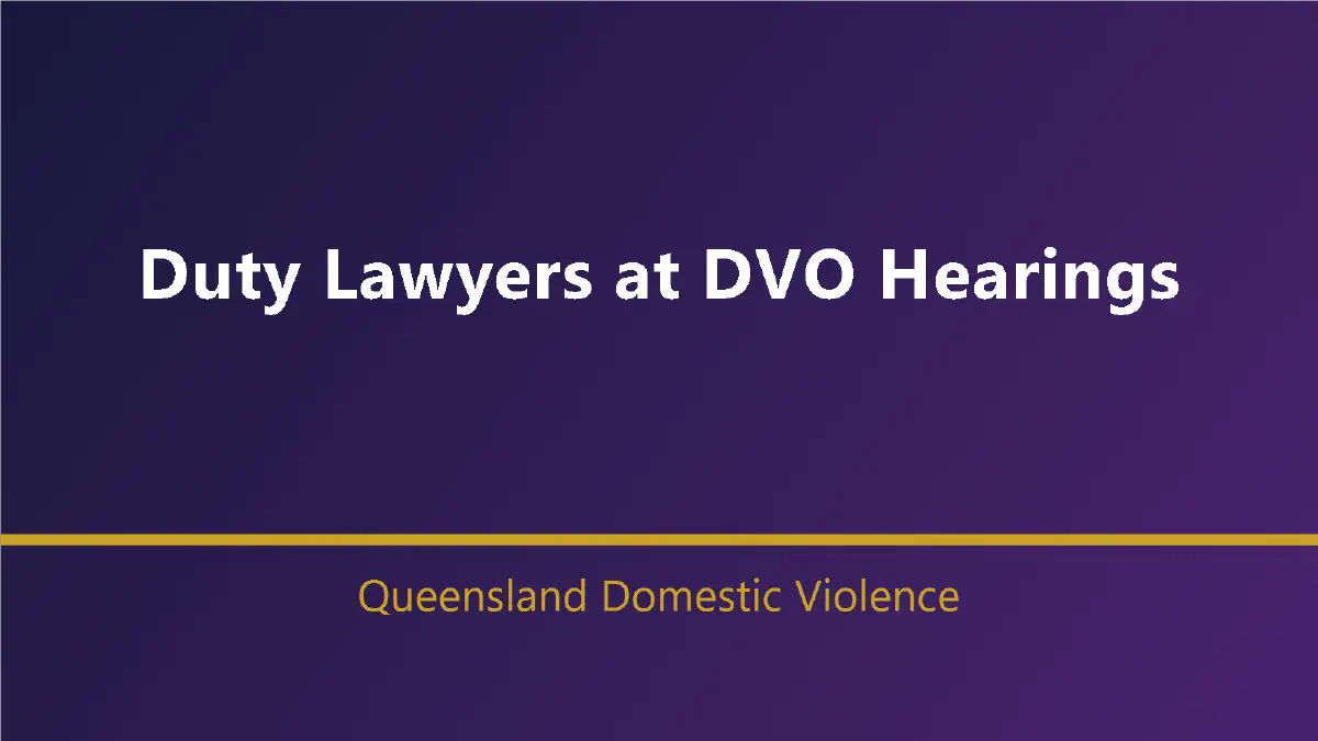 A professional duty lawyer in a royal-purple tie speaking quietly with a client outside a modern Queensland Magistrates Court, with subtle gold architectural accents and no identifiable faces